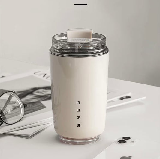 SMEG stainless steel thermos on a bright kitchen counter, ready to keep your drinks hot or cold